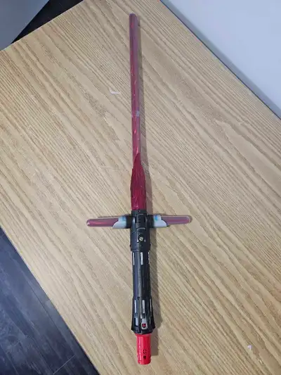 Kylo Ren lightsaber from Star Wars. Lights up red, has battle sounds and power on/off sounds. Great...