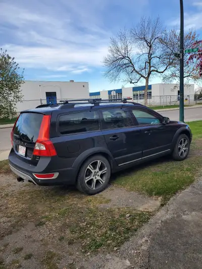 This is a Volvo XC70 T6 Mileage is high as previous owner commuted from Calgary to Canmore for work....