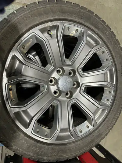 These are four used GMC Sierra 1500 Denali Ultimate tires, size 285/45R22, complete with factory 22-...