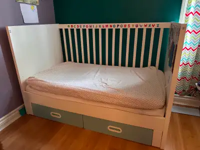 IKEA STUVA crib converts to toddler bed. 4.5 feet x 2.5 feet, comes with two crib-size mattresses, m...