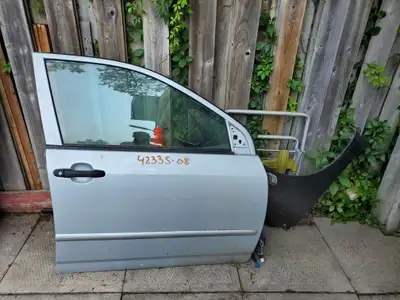 Corolla CE front door panel part no. 67610-02590E0 with electrical wiring for side mirror will fit 1...