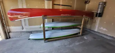 Kayak/Canoe rack. Made from pressure treated wood, it can be used inside or outdoors (it was stored...