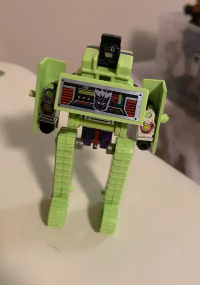 This is a vintage G1 Transformers Devastator action figure, originally released in the 1980s. As you...