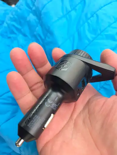 This is a Scosche ReTrak Power audio adapter. It's a car charger with an audio transmitter function....