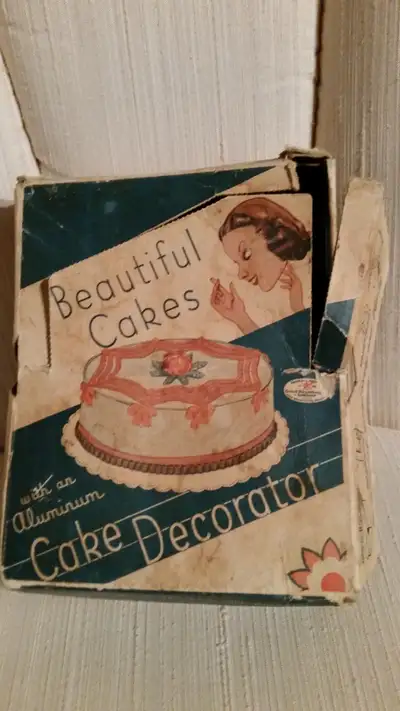 Vintage cake decorator kit in original box, View more