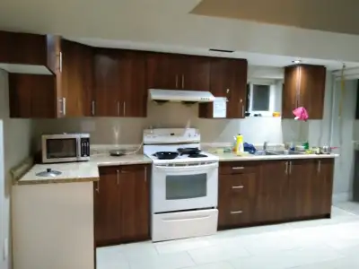 Shared spacious room for rent at basement of the house for Girls available immediately Furnished Kit...