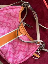 Women’s COACH pink/orange purse / bag. 