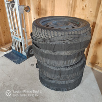 WINTER TIRES ON STEEL RIMS AND COVER. $500