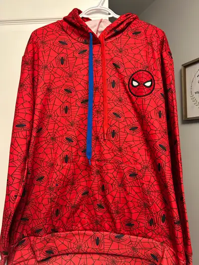 Get ready to swing into action with this vibrant, used Spider-Man/Marvel sweater, perfect for any fa...