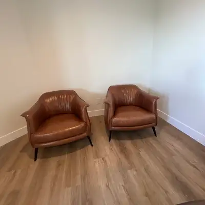  2 leather chairs , View more