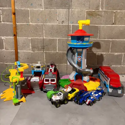 Large collection of Paw Patrol playsets and vehicles including the original Paw Patrol Tower, Monkey...