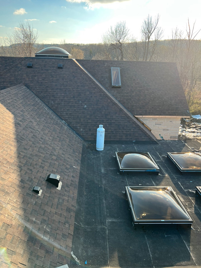 Soffit fascia eaves metal roof shingles leaf guards skylight Roofing Mississauga / Peel