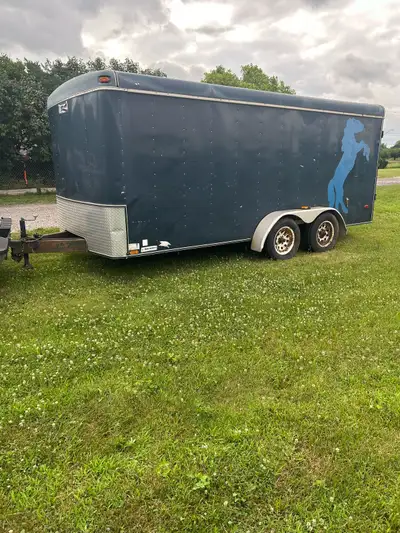 16 ft double axle, fully enclosed utility trailer for sale. The tires are good. Rims are a bit rusty...