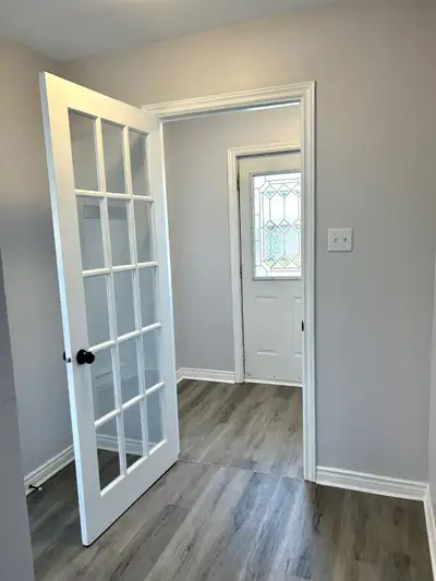 As you enter through the front door at 107 Greenspond Drive you are greeted by a spacious porch area...