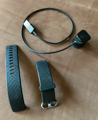 Fitbit Charge 3 strap (size L) and charger. $5 for both. Smoke-free and pet free home. Pick up in Sc...