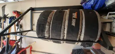 Here we have a preowned wall mounted tire rack with mounting hardware. Please see pictures for exact...