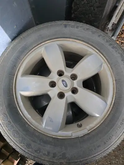 Looking to sell set of Ford Escape 17" rims , tire are eorn out