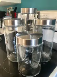 Set of 4 glass canisters with stainless steel lids 