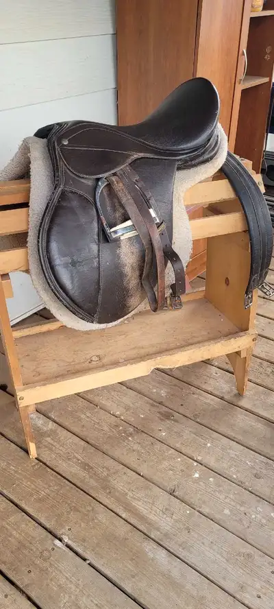 General purpose saddle.includes stirrups girth.16 inch