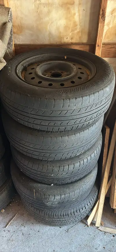 Used tires with rims for sale. Size is 205/65/R16. As you can see the tires thread is fully finished...