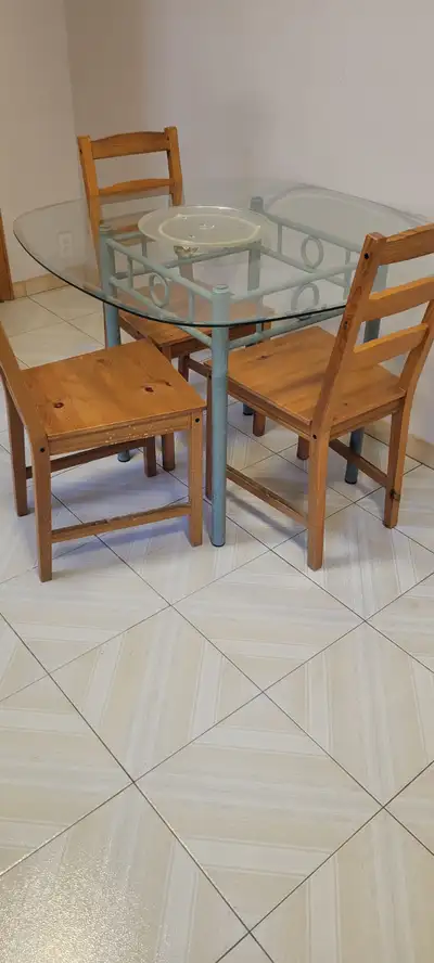 GLASS DINNING/BREAKFAST TABLE AND 4 wood CHAIRS IN GOOD CONDTION, View more
