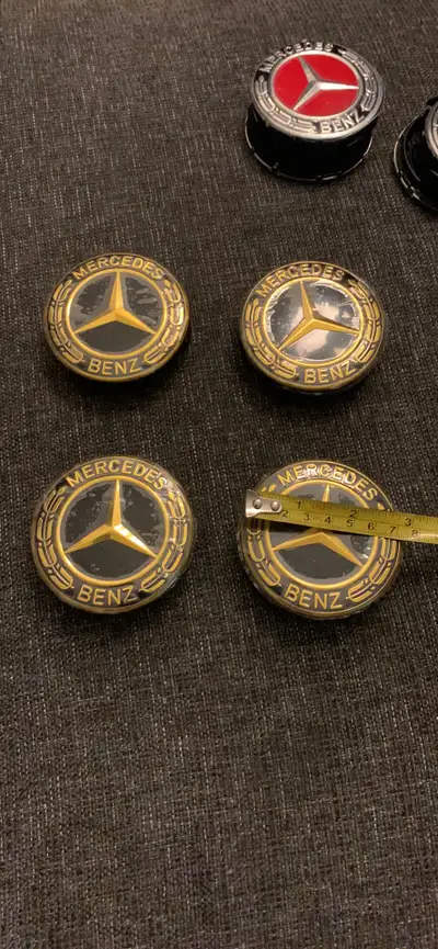 Mercedes, black and gold, 75 mm centre caps for rims Brand new in package Check out my ads for other...