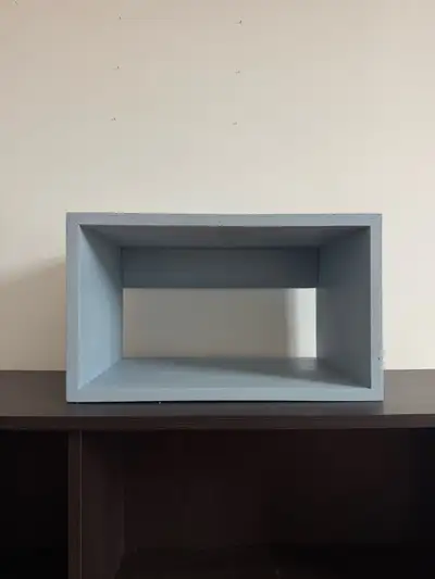 Cute light blue wood shelf. Has a rectangular shape. Can be used as a cubby or floating shelf. Comes...