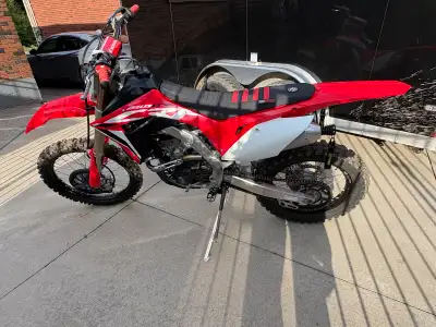 2020 Honda CRF250RX offers agility and power, featuring a liquid-cooled 250cc engine and a lightweig...