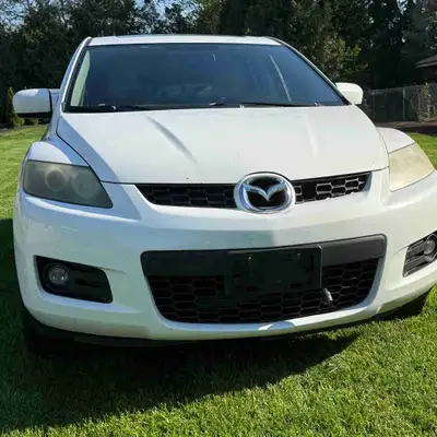 This 2007 Mazda CX-7 is a compact SUV, perfect for navigating city streets or embarking on longer jo...