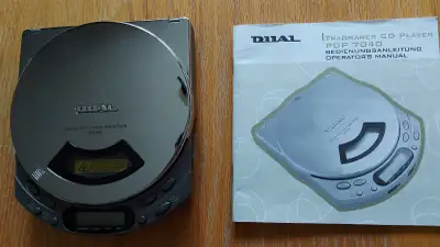 Portable CD player from Dual. Battery powered. Can be connected to amplifiers or stereo system. Come...