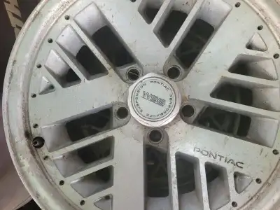 late 80s early 90s Pontiac rims and tires need good clearing hard to find all 4 about 70% on tires