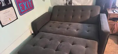 Dark grey pull out couch, View more
