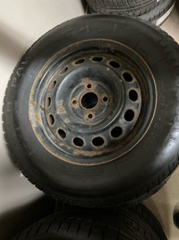 185/70/R14 Uniroyal winter tires. On black generic wheels