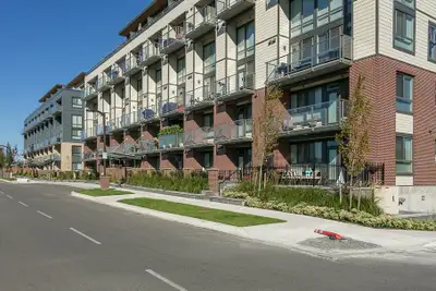 This bright and modern loft-style home is located in Hudson’s Loft, a well-maintained concrete and w...