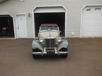 75 year old MGTD.Excellent,red leather seats,wooden dash and steering wheel,1800 MGB engine and over...