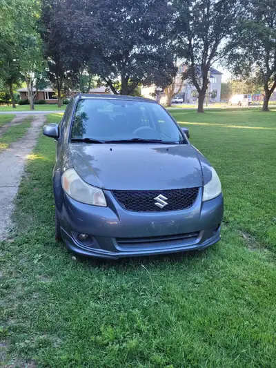 This reliable Suzuki SX4 sedan has 142,093 km on the odometer and offers a comfortable ride for your...