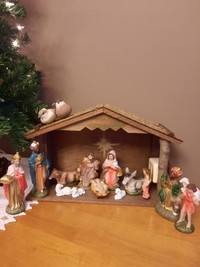 Nativity set with stable and music