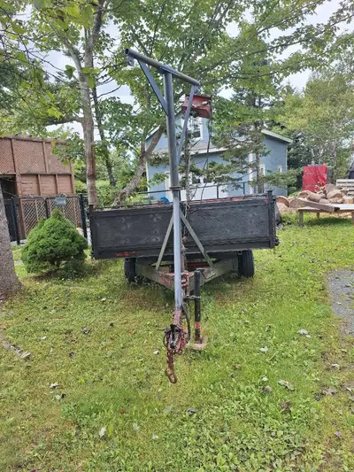 Check out this used utility trailer, perfect for hauling all sorts of things! It's got a sturdy buil...