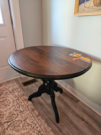 Round wooden table with painted cat
