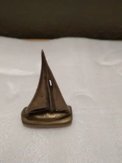 Small vintage brass sail boat., View more