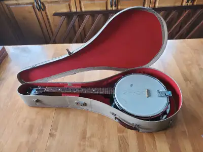Plectrum or Irish-style four-string banjo made by John Grey & Sons in likely the 1950-1960s. Functio...