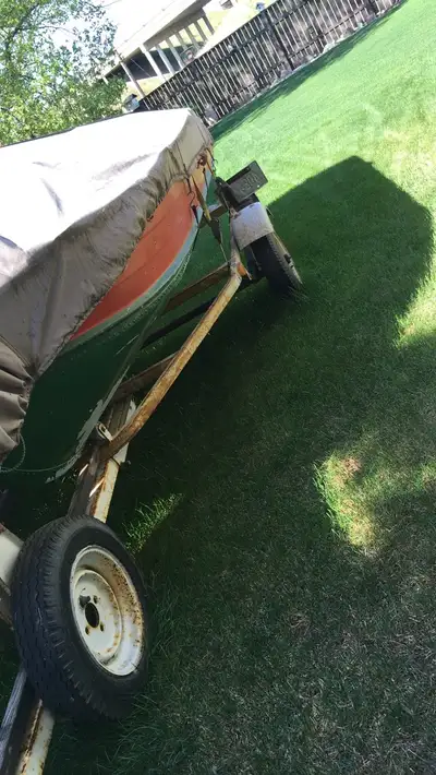 Selling my 12 ft sears aluminum boat with trailer and a gas 9.9 outboard motor and also has an elect...