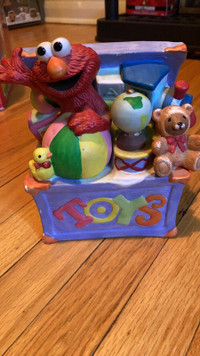 Sesame Street Elmo in toy chest statue 