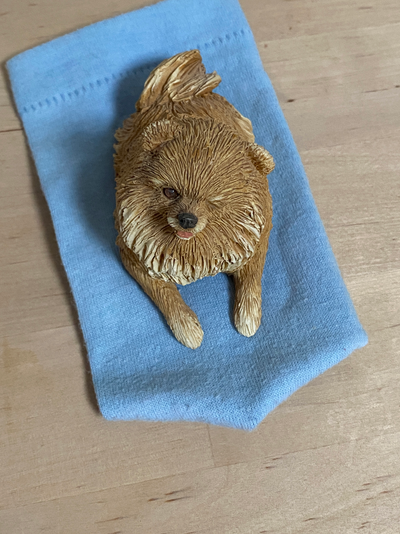 Pomeranian Statue - Small winking Pomeranian, Sandicast, about 3 inches long, $10.00 Pick up in Port...