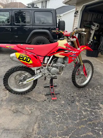 Has 89 hours, well maintained. Needs a new bike tire It Runs great. Comes with a larger aftermarket...