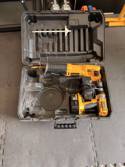 DeWalt kit comes with reciprocating saw, hammer drill, battery, charger and case. Used in great cond...