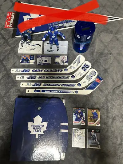 Lot of Toronto Maple Leafs stuff Include: - 2 McFarlane figures - Dion Phaneuf & Jason Blake - 1 bat...