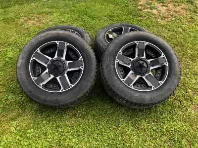 Selling a set of 4 rockstar rims in good shape with studded winter tires 265 60 R18 about 50% tread...