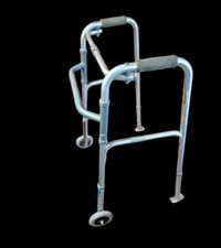 Folding Walker with wheels and sliders.