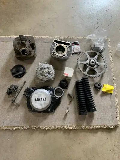 Various engine parts. Cylinder Head. Side cover. Clutch. Kick start shaft. Sprockets. Sell separatel...